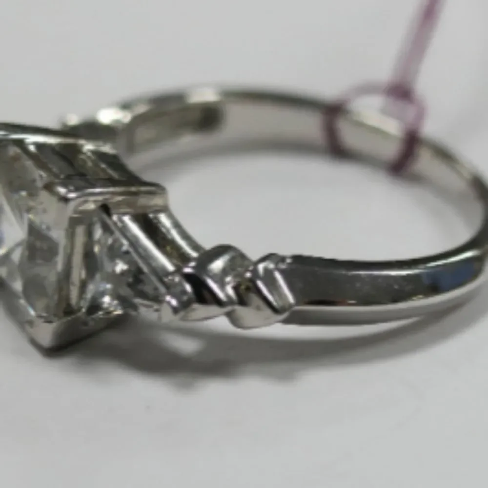 Sterling Silver Ring with Princess Cut Center CZ Stone Flanked by Triangular CZs